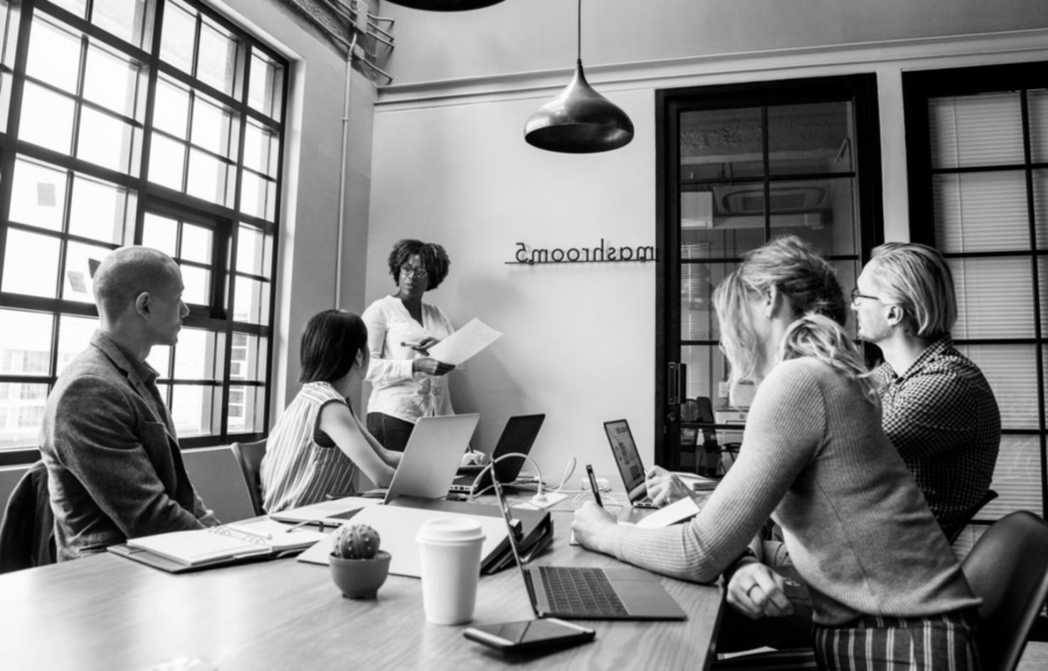 Professional budget planning workspace with laptop and financial documents